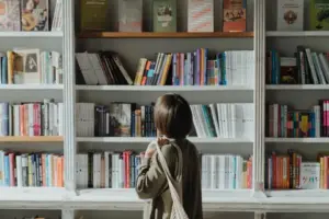 Reader browsing books in a library